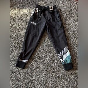 Near Fall Wrestling Joggers with zippers on each bottom side.